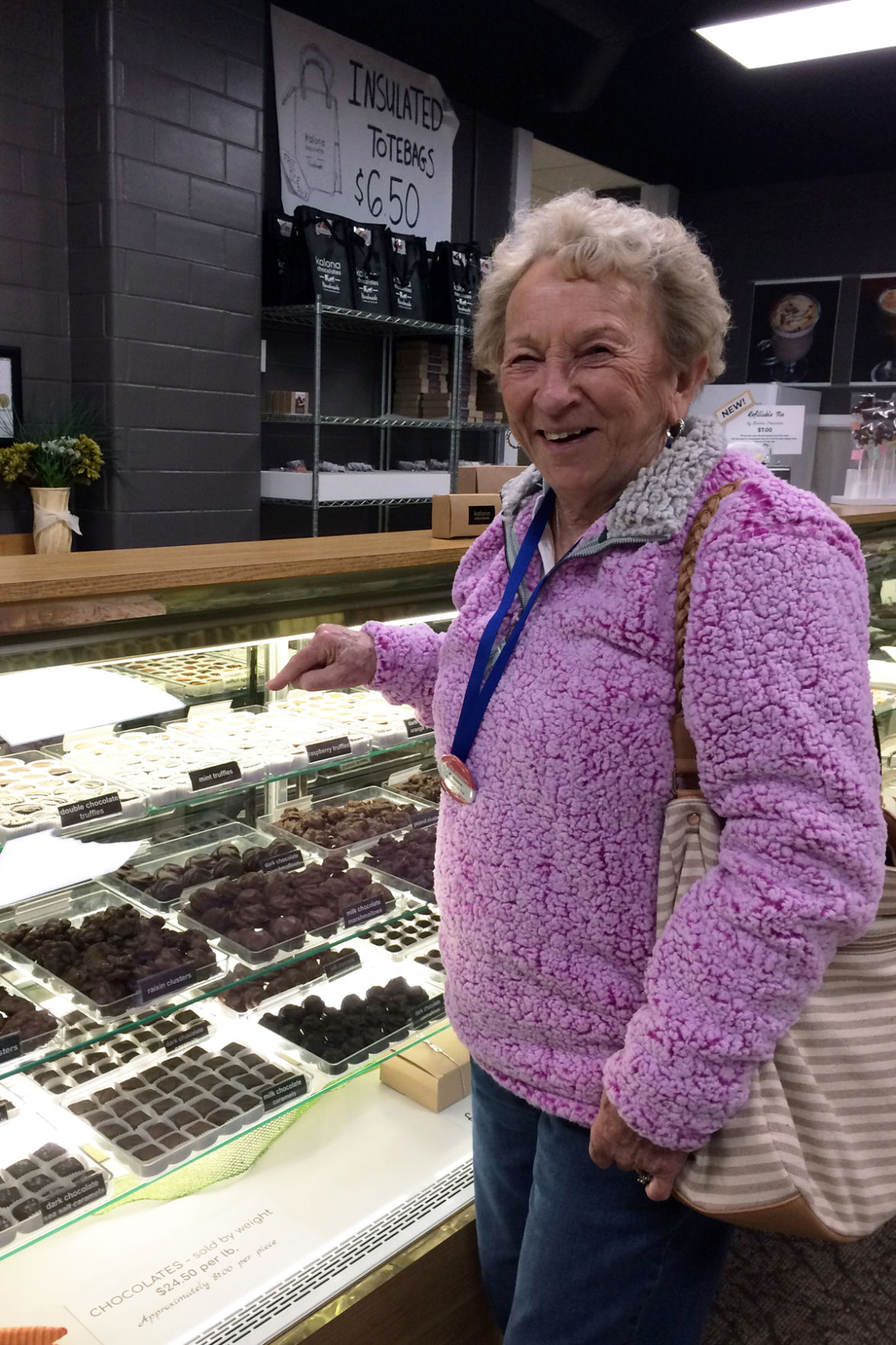 070 Agnes Loukota finds lots of goodies in the display cases.JPG
